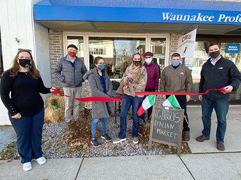 Business ribbon-cutting ceremony held by the Waunakee Area Chamber of Commerce